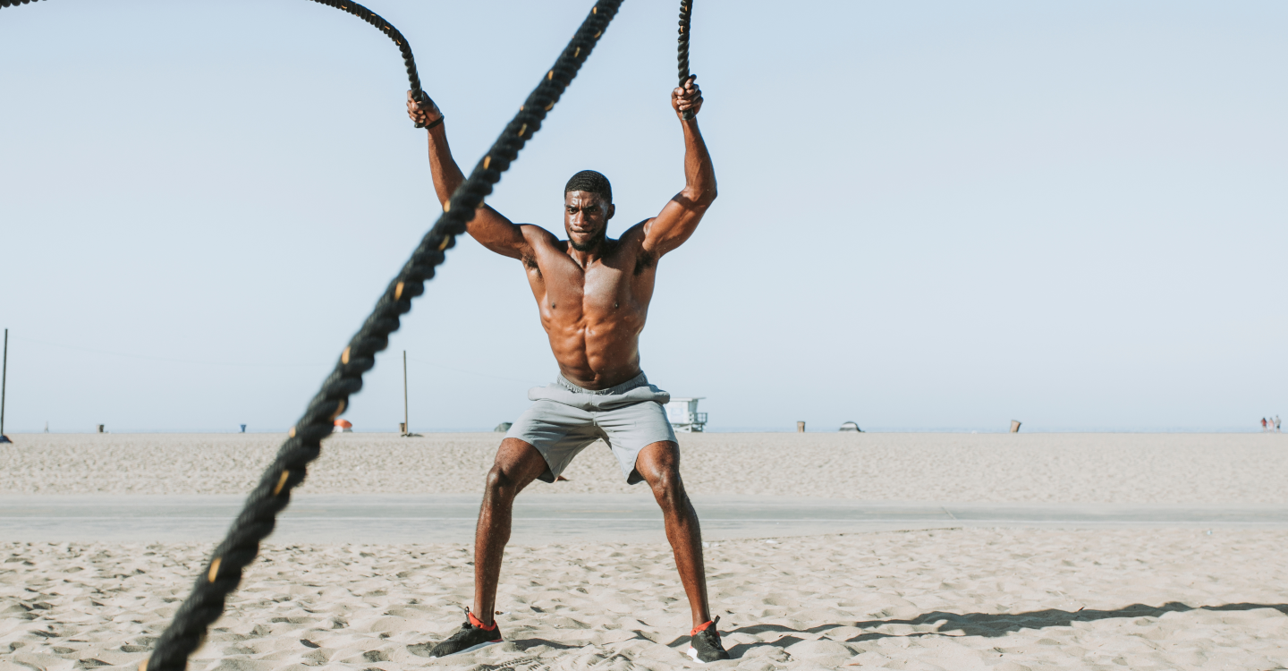 Man working out on beach
